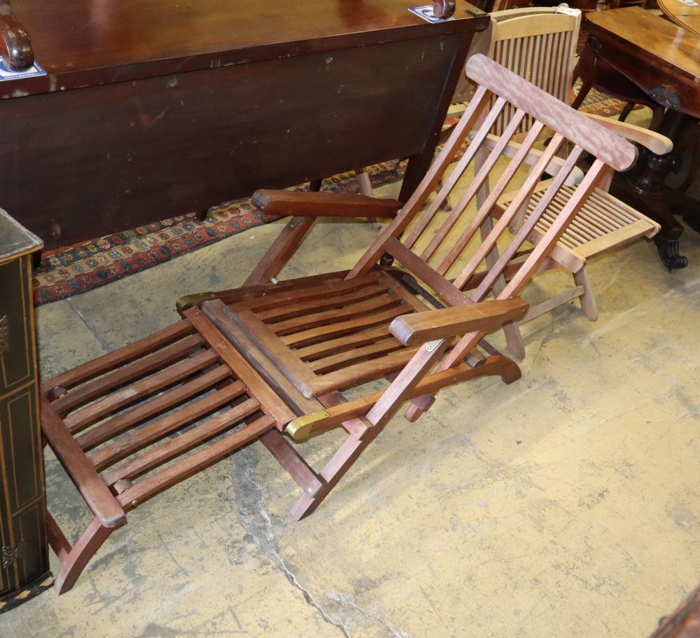 A pair of teak folding garden chairs and a teak steamer chair